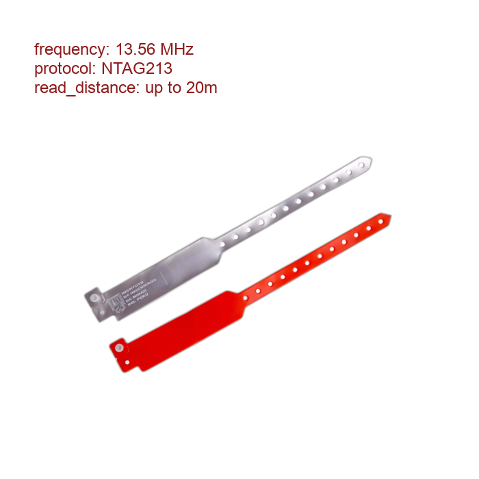 Two flat, elongated metal blades with perforated handles, one silver and one red, laid diagonally.