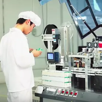 RFID factory worker operating production equipment
