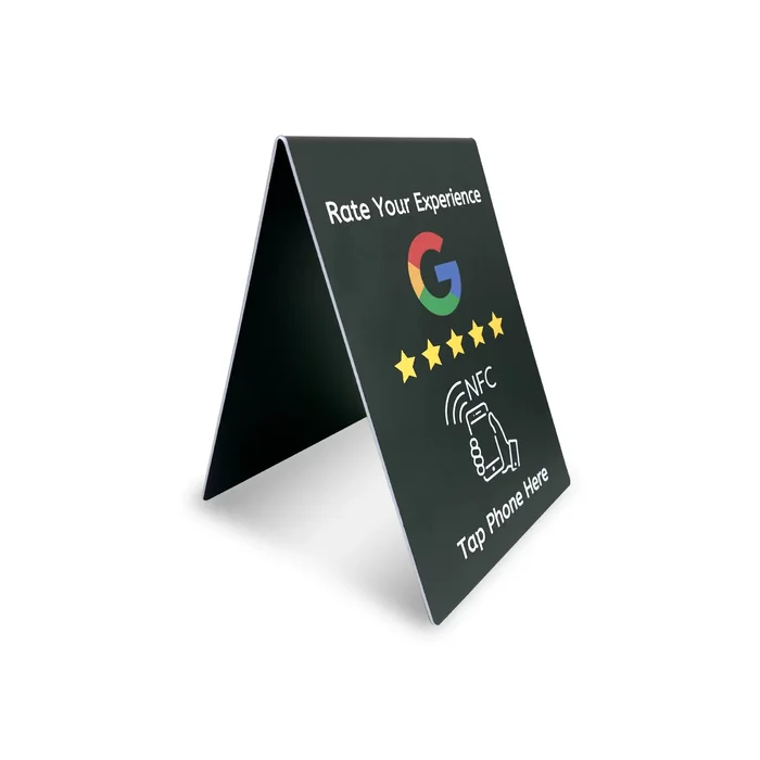 V-shaped dark review stand with a printed NFC tap prompt.