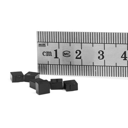 CER0505 5mm ceramic UHF RFID tags beside a millimetre ruler